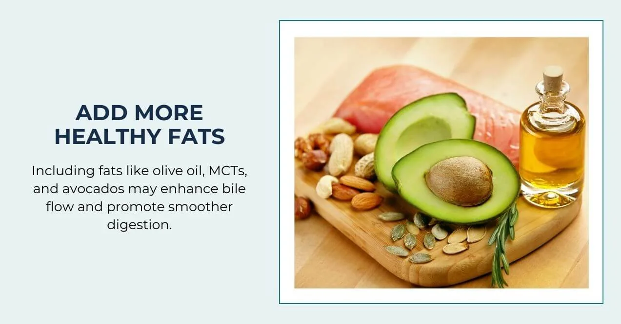 Avocado, nuts, salmon, and oil on cutting board promoting healthy fat intake