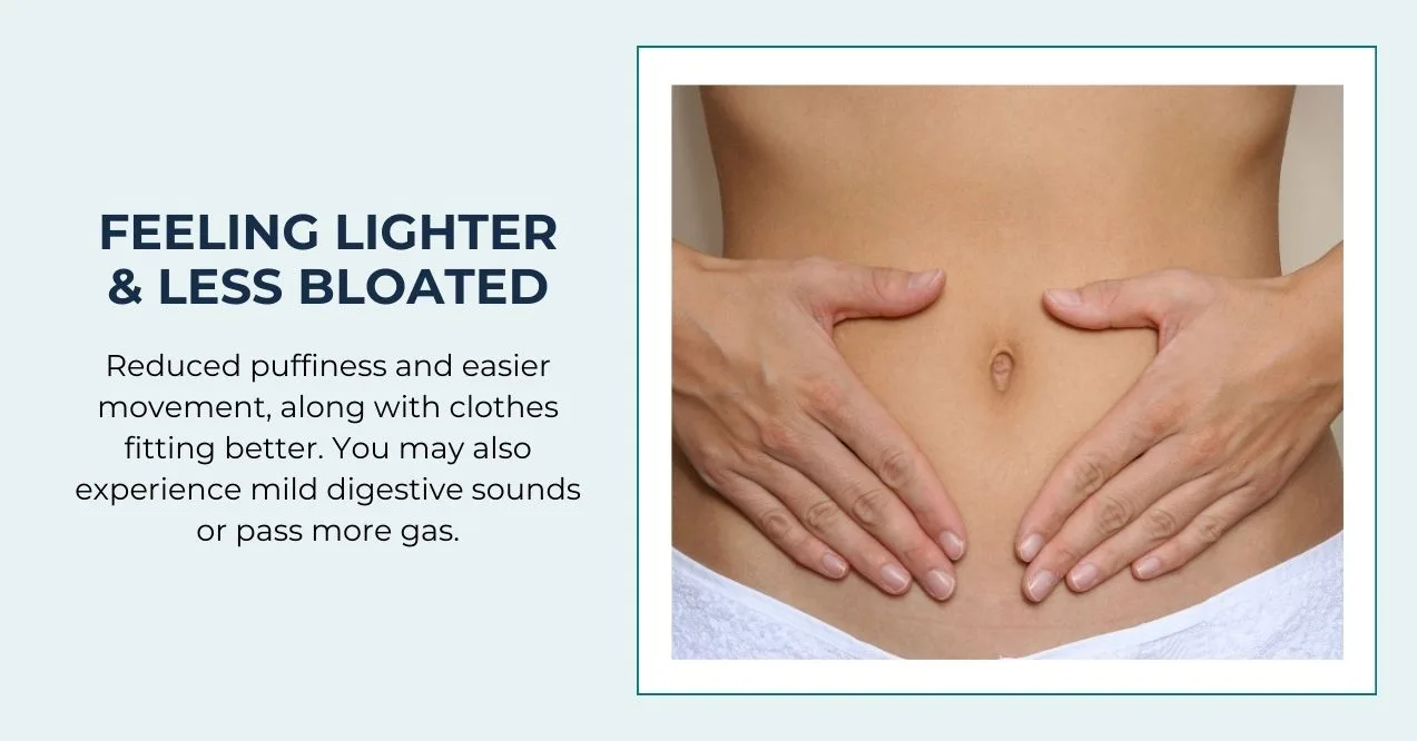Hands on the abdomen of a woman showing feeling lighter and less bloated.