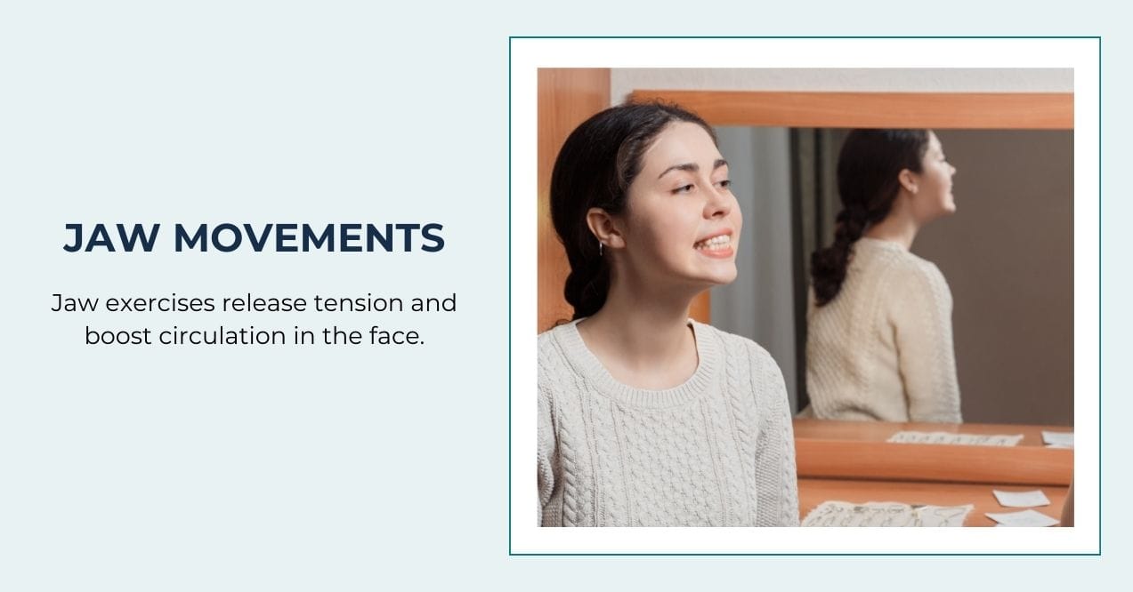 Woman practicing jaw exercise in front of a mirror wearing a light sweater.