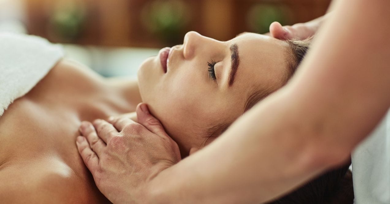 Lymphatic massage therapy in progress with a client relaxing revealing the question when do you feel better after lymphatic massage