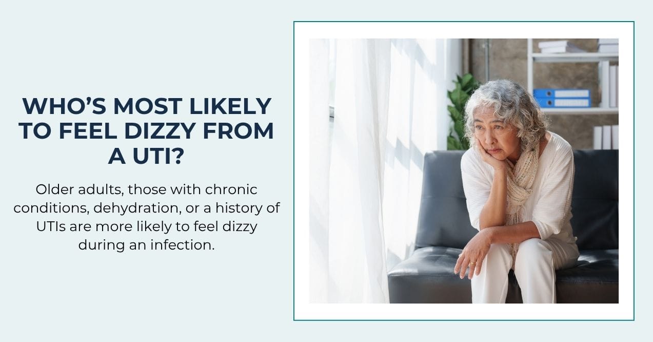 Older woman sitting on a couch, looking fatigued or dizzy near window light.