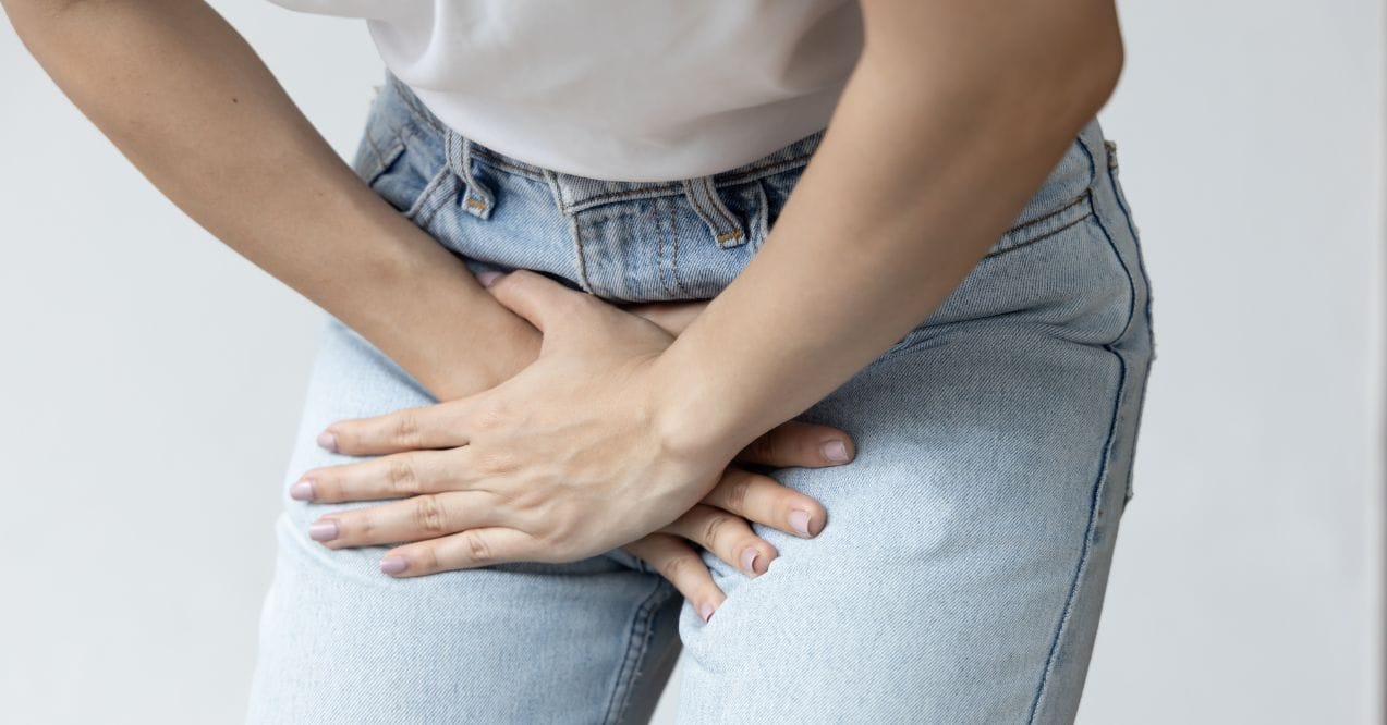 Woman experiencing UTI discomfort resembling the topic can a uti make you dizzy