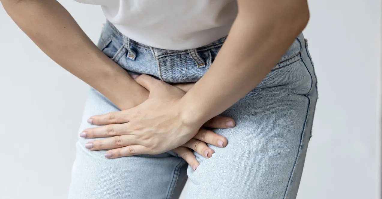 Woman experiencing UTI discomfort resembling the topic can a uti make you dizzy