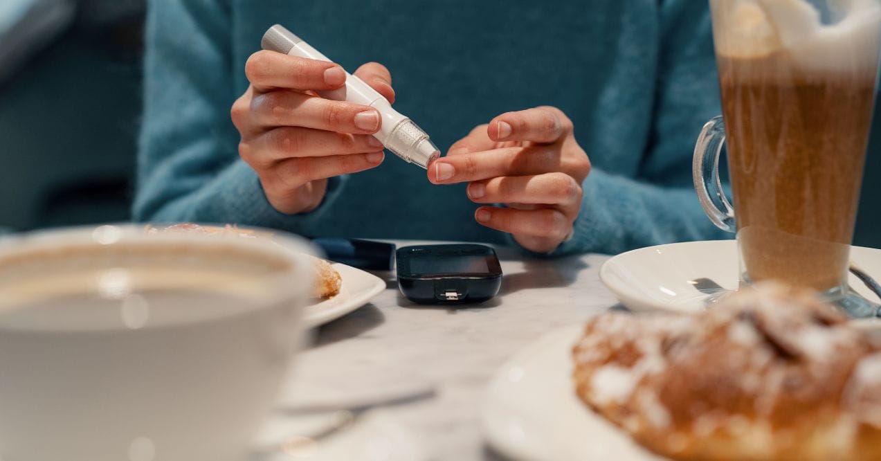 Person checking does glucose rise when hungry at breakfast table