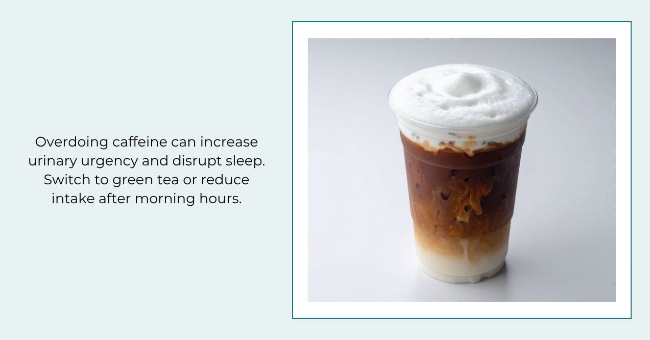 Iced latte in a clear cup with foamy top