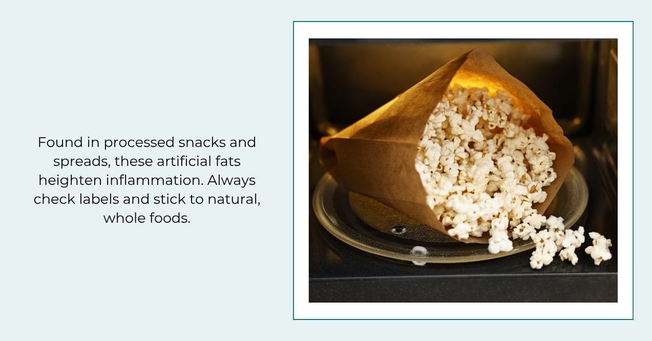 Bag of microwave popcorn spilling from the oven